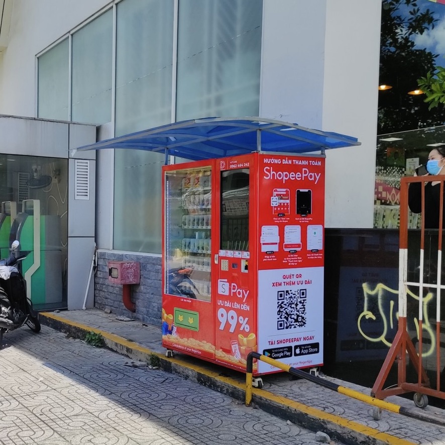 ShopeePay 99% promo red wrap at supermarket entrance