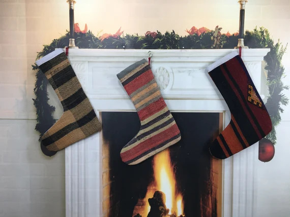 15+ Christmas wall decor ideas for a cheerful 2022 season 50 Christmas Wall Decor - Christmas wall decor with socks