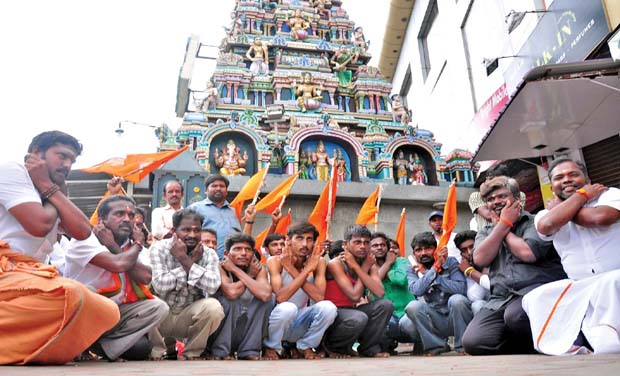 Bharat Sena staged a protest by making sit ups- Thoppukaranam in front of Vinayakar temple in Gandhipurma signal on Tuesday morning, seeking the release of AIADMK party general secretary J. Jayalalithaa. (Photo: DC/File) Bharat Sena staged a protest by making sit ups- Thoppukaranam in front of Vinayakar temple in Gandhipurma signal on Tuesday morning, seeking the release of AIADMK party general secretary J. Jayalalithaa. (Photo: DC/File)