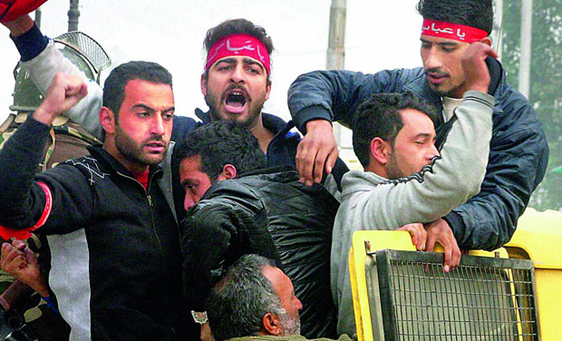 Police detains Shia mourners after they tried to take out a procession defying restrictions to mark the 10th day of Muharram at Ghanta Ghar in Srinagar on Tuesday. (Photo: PTI) Police detains Shia mourners after they tried to take out a procession defying restrictions to mark the 10th day of Muharram at Ghanta Ghar in Srinagar on Tuesday. (Photo: PTI)