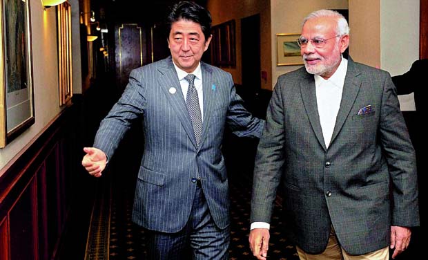 Japanese PM Shinzo Abe with PM Narendra Modi in Brisbane (Photo: PTI) Japanese PM Shinzo Abe with PM Narendra Modi in Brisbane (Photo: PTI)