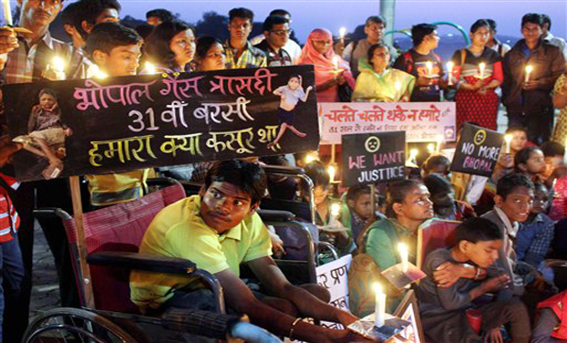 Children of survivors of gas tragedy light candles to pay tributes to pay tribute to the victims of gas tragedy on the eve of 31st anniversary of gas disaster in Bhopal. (Photo: AP) Children of survivors of gas tragedy light candles to pay tributes to pay tribute to the victims of gas tragedy on the eve of 31st anniversary of gas disaster in Bhopal. (Photo: AP)
