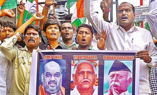 Youth Congress workers stage a protest in Bengaluru on Tuesday agaisnt RSS chief Mohan Bhagwat for his remarks on a Hindu nation. Youth Congress workers stage a protest in Bengaluru on Tuesday agaisnt RSS chief Mohan Bhagwat for his remarks on a Hindu nation.