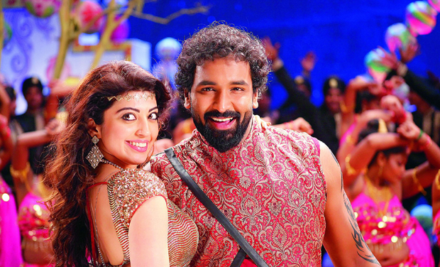 Pranitha and Vishnu Manchu in a still from Dynamite Pranitha and Vishnu Manchu in a still from Dynamite