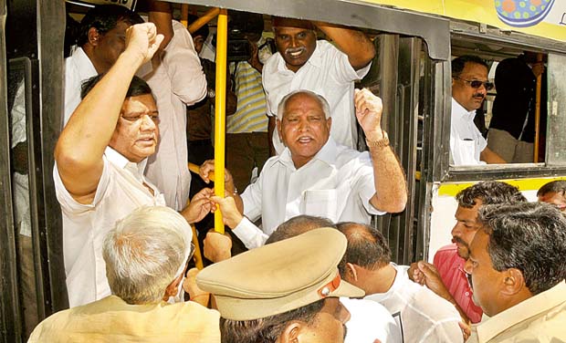 Former chief ministers B.S. Yeddyurappa and Jagadish Shettar shout slogans against the State government demanding four ministers accused of land encroachment be dropped from the cabinet in Bengaluru on Thursday (Photo: DC) Former chief ministers B.S. Yeddyurappa and Jagadish Shettar shout slogans against the State government demanding four ministers accused of land encroachment be dropped from the cabinet in Bengaluru on Thursday (Photo: DC)