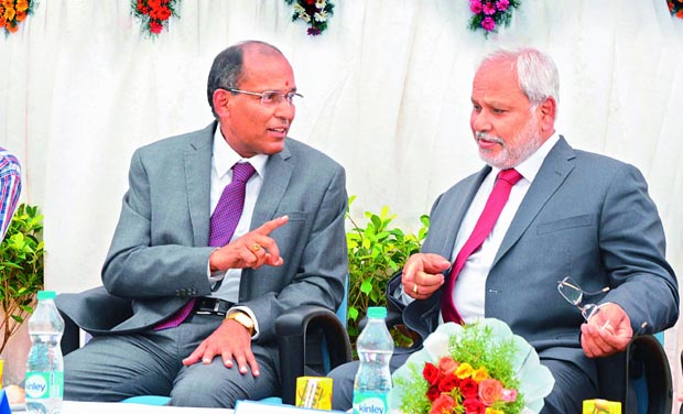 CMD of RINL-VSP P. Madhusudan has a word with CMD of Power Grid R.N. Nayak during the foundation stone setting ceremony of Transmission Line Tower Project at Visakhapatnam Steel Plant on Friday. (Photo: DC) CMD of RINL-VSP P. Madhusudan has a word with CMD of Power Grid R.N. Nayak during the foundation stone setting ceremony of Transmission Line Tower Project at Visakhapatnam Steel Plant on Friday. (Photo: DC)