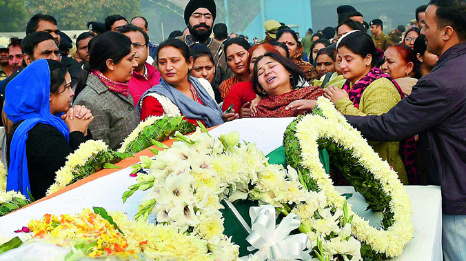 Family members of crash victim break down during a wreath laying ceremony in New Delhi. (Photo: PTI) Family members of crash victim break down during a wreath laying ceremony in New Delhi. (Photo: PTI)