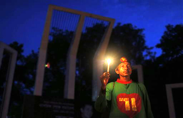 A Bangladeshi activist holds a candle, as they protest against the killing of secular blogger Niladri Chottopadhay Niloy in Dhaka, Bangladesh. Two suspected members of a Bangladeshi Muslim militant group, including one who was out on bail on a A Bangladeshi activist holds a candle, as they protest against the killing of secular blogger Niladri Chottopadhay Niloy in Dhaka, Bangladesh. Two suspected members of a Bangladeshi Muslim militant group, including one who was out on bail on a