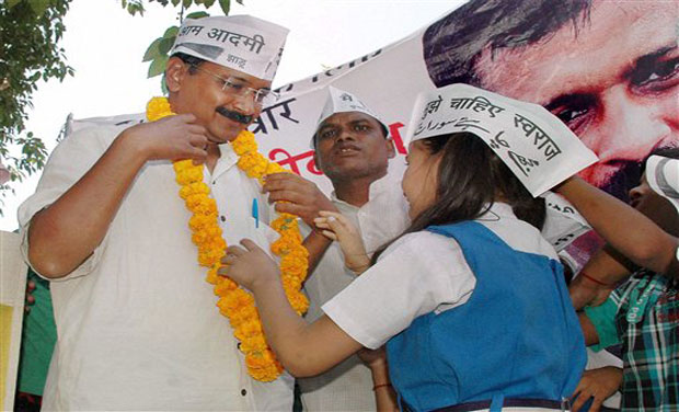 Aam Aadmi Party convener Arvind Kejriwal with school children during an election campaign in Varanasi. (Photo: AP) Aam Aadmi Party convener Arvind Kejriwal with school children during an election campaign in Varanasi. (Photo: AP)