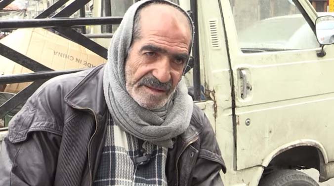 On a cold winter's day in the capital's Marja Square, the 62-year-old leans back against his soot-streaked white Suzuki, parked next to a wooden crate filled with the packs of cigarettes that are his livelihood. (Photo: YouTube Video Grab/ AFP) On a cold winter's day in the capital's Marja Square, the 62-year-old leans back against his soot-streaked white Suzuki, parked next to a wooden crate filled with the packs of cigarettes that are his livelihood. (Photo: YouTube Video Grab/ AFP)