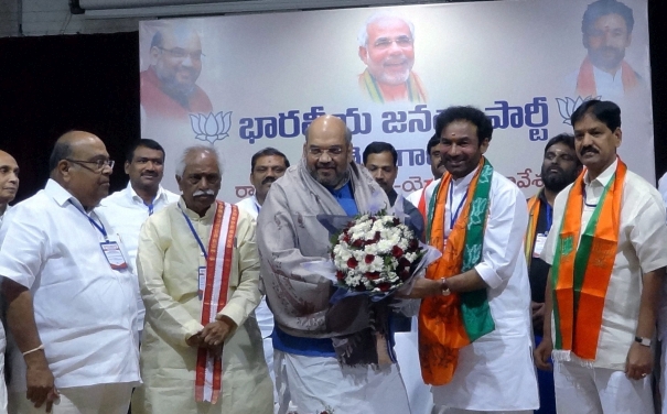BJP President Amit Shah being welcomed by Telangana president G Kishan Reddy at a party event in Hyderabad (Photo: PTI) BJP President Amit Shah being welcomed by Telangana president G Kishan Reddy at a party event in Hyderabad (Photo: PTI)