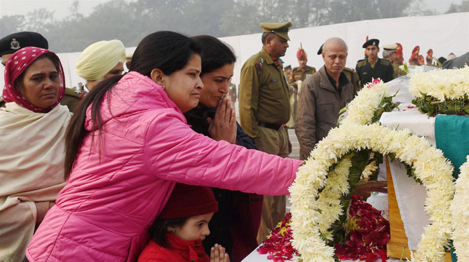 Family members of BSF officer Rajesh Shivrain break down while paying tribute to him during a wreath laying ceremony for the victims of Dwarka plane crash, at Safdarjung airport in New Delhi (Photo: PTI) Family members of BSF officer Rajesh Shivrain break down while paying tribute to him during a wreath laying ceremony for the victims of Dwarka plane crash, at Safdarjung airport in New Delhi (Photo: PTI)