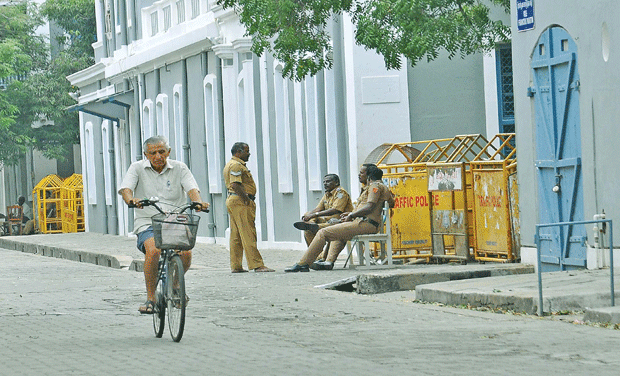Policemen on guard outside the premises of Sri Aurobindo Ashram. (Photo: DC/File) Policemen on guard outside the premises of Sri Aurobindo Ashram. (Photo: DC/File)