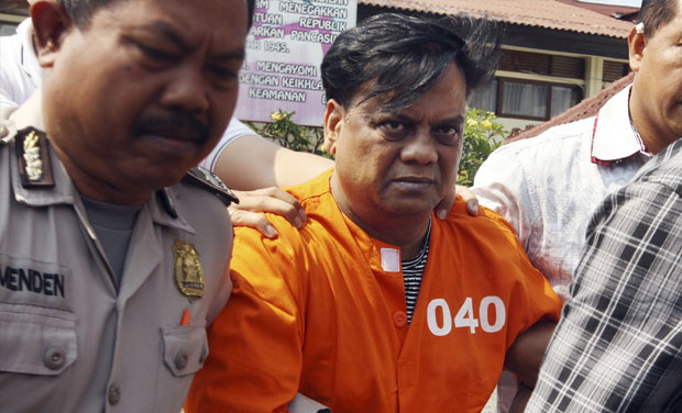 Fugitive Rajendra Sadashiv Nikalje, alias Chhota Rajan, escorted by plain-clothed police officers (Photo: PTI/File) Fugitive Rajendra Sadashiv Nikalje, alias Chhota Rajan, escorted by plain-clothed police officers (Photo: PTI/File)