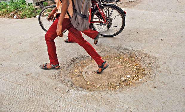 The concrete roads laid six month ago at 14th sector, K. K. Nagar, do not provide a safe ride for motorist as sunken manholes pose dangerous threat. (Photo: DC/File) The concrete roads laid six month ago at 14th sector, K. K. Nagar, do not provide a safe ride for motorist as sunken manholes pose dangerous threat. (Photo: DC/File)