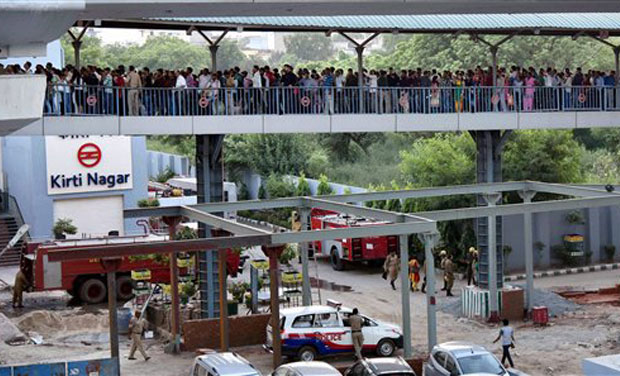 Passengers waiting in queues outside the metro station after a fire incident took place at Kirti Nagar Metro station in New Delhi. (Photo: PTI) Passengers waiting in queues outside the metro station after a fire incident took place at Kirti Nagar Metro station in New Delhi. (Photo: PTI)