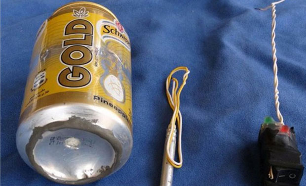IS magazine posted a photo showing a can of Schweppes Gold soft drink and what appeared to be a detonator and switch on a blue background (Photo: Twitter) IS magazine posted a photo showing a can of Schweppes Gold soft drink and what appeared to be a detonator and switch on a blue background (Photo: Twitter)