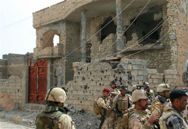 In this photo released by the Iraqi Army taken on March 20, 2014, Iraqi Security forces deploy after clashes with militants in Ramadi, 70 miles (115 kilometers) west of Baghdad, Iraq. Photo- AP In this photo released by the Iraqi Army taken on March 20, 2014, Iraqi Security forces deploy after clashes with militants in Ramadi, 70 miles (115 kilometers) west of Baghdad, Iraq. Photo- AP