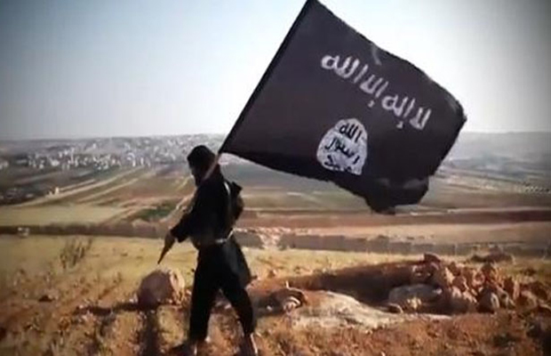 Member of the Islamic State group waving the group's flag (Photo: AFP) Member of the Islamic State group waving the group's flag (Photo: AFP)