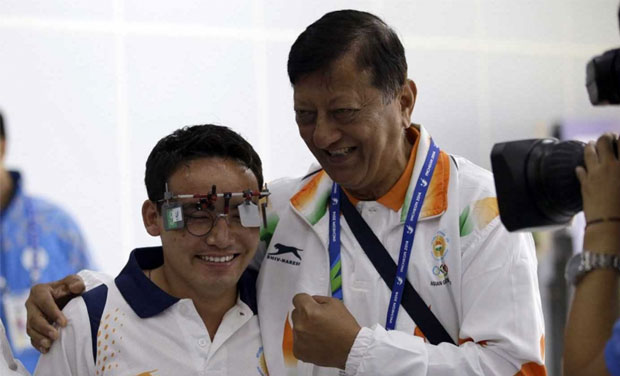 Jitu Rai (left) with his coach Mohinder Lal at the Asian Games (Photo: AP) Jitu Rai (left) with his coach Mohinder Lal at the Asian Games (Photo: AP)