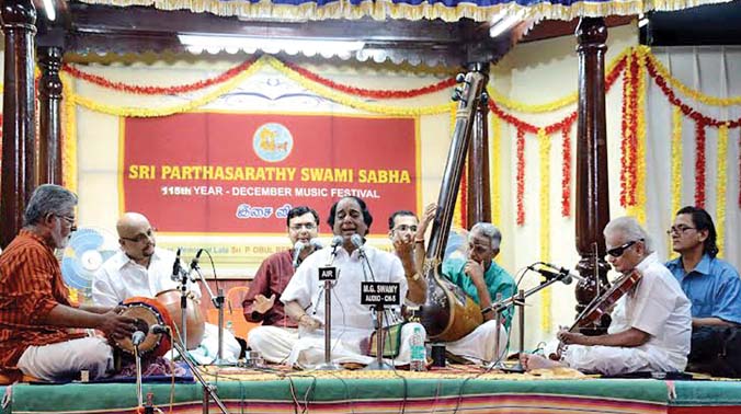 (Left) Veteran musician T.N. Seshagopalan performs at Sre Parthasarathy Swami Sabha in the city on Tuesday. Carnatica distributes flood relief funds to 35 musicians along with Cleveland Thyagaraja Aradhana, Ravikiran Foundation of India and (Left) Veteran musician T.N. Seshagopalan performs at Sre Parthasarathy Swami Sabha in the city on Tuesday. Carnatica distributes flood relief funds to 35 musicians along with Cleveland Thyagaraja Aradhana, Ravikiran Foundation of India and