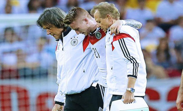 Marco Reus was helped off the pitch by two of the medical staff and taken to hospital in Mainz where scans revealed the damage. Photo: AP Marco Reus was helped off the pitch by two of the medical staff and taken to hospital in Mainz where scans revealed the damage. Photo: AP
