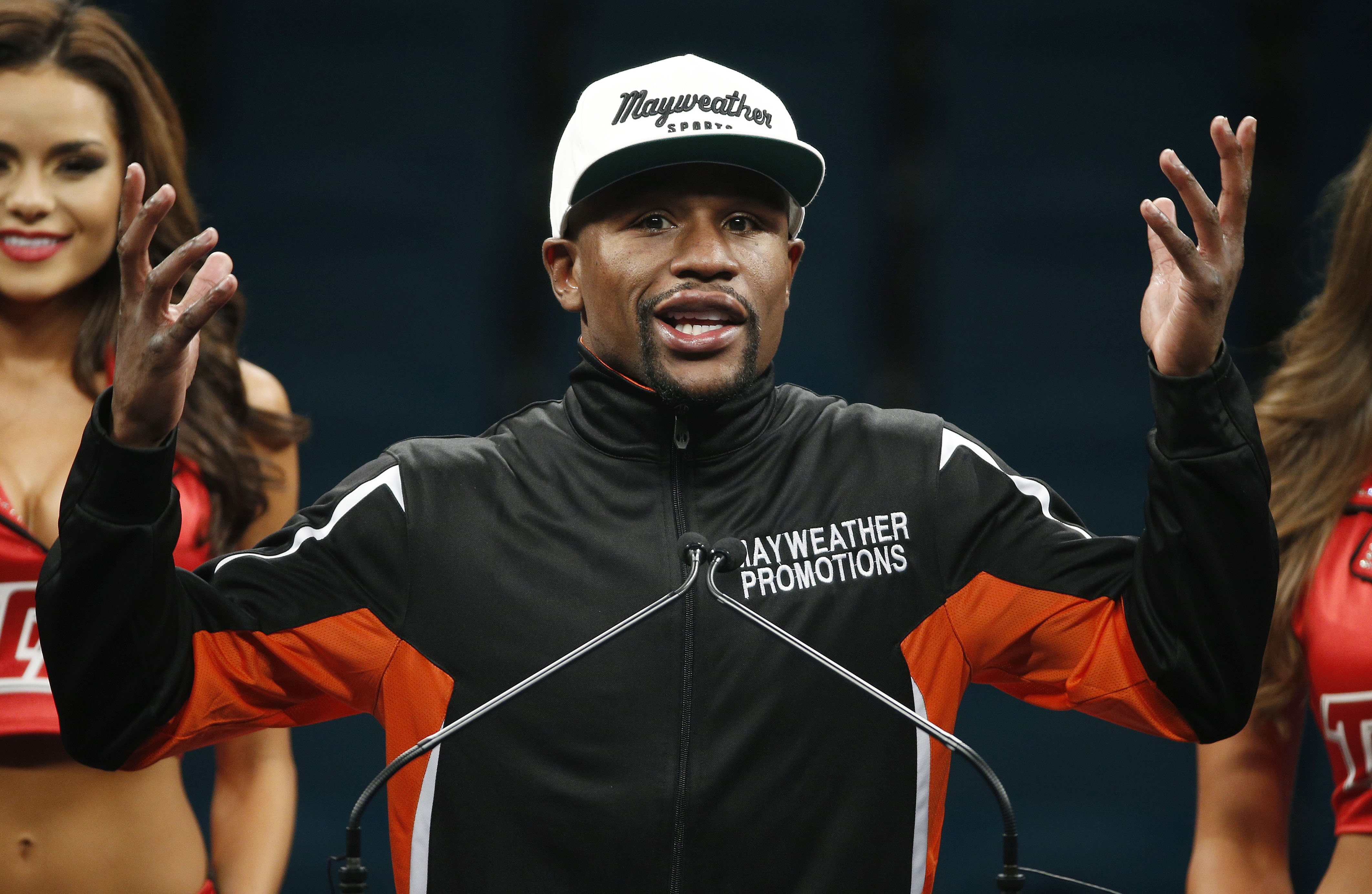 Two days after saying he would be open to a re-match with Manny Pacquiao, unbeaten American Floyd Mayweather Jr. reversed course while describing the Filipino as "a sore loser". (Photo: AP) Two days after saying he would be open to a re-match with Manny Pacquiao, unbeaten American Floyd Mayweather Jr. reversed course while describing the Filipino as "a sore loser". (Photo: AP)