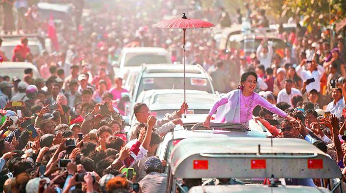 A new age: Myanmar Opposition leader Aung San Suu Kyi greets supporters as she leaves a ceremony to mark the 100th birthday of independence hero Aung San in the remote central Myanmar town of Natmauk. (Photo: AFP) A new age: Myanmar Opposition leader Aung San Suu Kyi greets supporters as she leaves a ceremony to mark the 100th birthday of independence hero Aung San in the remote central Myanmar town of Natmauk. (Photo: AFP)