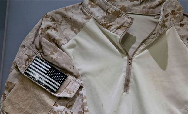 The fatigue shirt worn by the U.S. Navy SEAL during the mission to capture Osama bin Laden, is seen in a case at the museum in New York. The shirt joins other items donated to the museum by persons involved with the mission (Photo: AP) The fatigue shirt worn by the U.S. Navy SEAL during the mission to capture Osama bin Laden, is seen in a case at the museum in New York. The shirt joins other items donated to the museum by persons involved with the mission (Photo: AP)