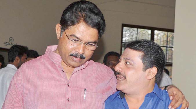 BJP leader R. Ashok (L) and JD(S) leader Zameer Ahmed Khan after casting their votes in Council polls, in Bengaluru. (Photo: DC) BJP leader R. Ashok (L) and JD(S) leader Zameer Ahmed Khan after casting their votes in Council polls, in Bengaluru. (Photo: DC)
