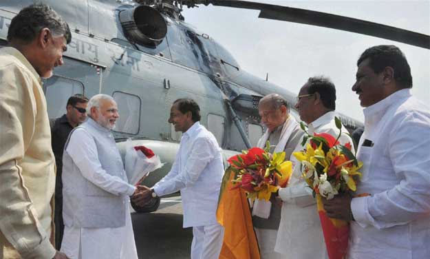 Prime Minister Narendra Modi being welcomed by Telangana CM K. Chandrasekhar Rao on his arrival at Amaravathi Helipad. Chief Minister of Andhra Pradesh, N. Chandrababu Naidu is also seen. (Photo: PTI) Prime Minister Narendra Modi being welcomed by Telangana CM K. Chandrasekhar Rao on his arrival at Amaravathi Helipad. Chief Minister of Andhra Pradesh, N. Chandrababu Naidu is also seen. (Photo: PTI)