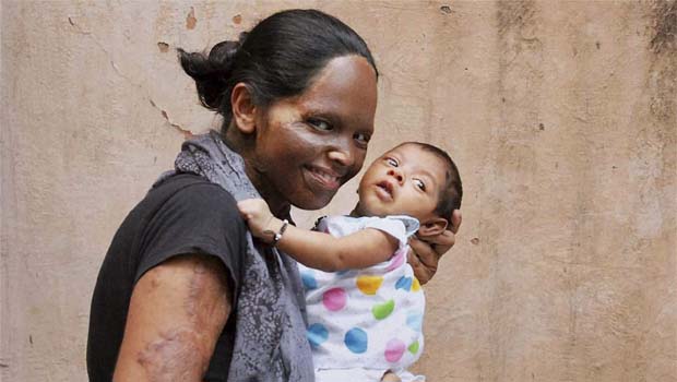 Acid attack survivor and activist Laxmi with her daughter in New Delhi (Photo: PTI) Acid attack survivor and activist Laxmi with her daughter in New Delhi (Photo: PTI)