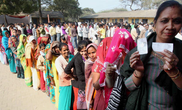 Women wait in a queue to cast their votes for Delhi Assembly elections, at a polling station at Badarpur in New Delhi on Wednesday. PTI Women wait in a queue to cast their votes for Delhi Assembly elections, at a polling station at Badarpur in New Delhi on Wednesday. PTI