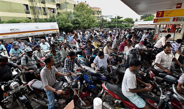 As the devastating floods led to several infrastructure bottlenecks across Chennai and its suburbs over the last week, retail fuel outlets reportedly "ran dry" following lack of supply. (Photo: PTI) As the devastating floods led to several infrastructure bottlenecks across Chennai and its suburbs over the last week, retail fuel outlets reportedly "ran dry" following lack of supply. (Photo: PTI)