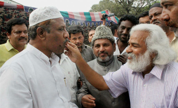 Revolutionary writer Gadder celebrates the passage of Telangana Bill by the Parliament, by distributing sweets in Hyderabad on Friday. PTI Revolutionary writer Gadder celebrates the passage of Telangana Bill by the Parliament, by distributing sweets in Hyderabad on Friday. PTI