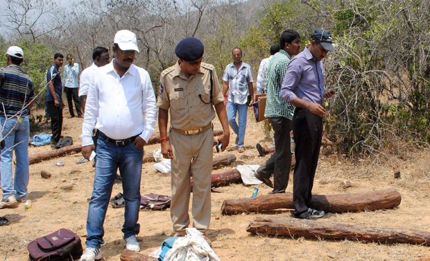 Police personnel and officials after an encounter with red sanders smugglers in Seshachalam forest near Srivari Mettu in Chittoor (Photo: PTI) Police personnel and officials after an encounter with red sanders smugglers in Seshachalam forest near Srivari Mettu in Chittoor (Photo: PTI)