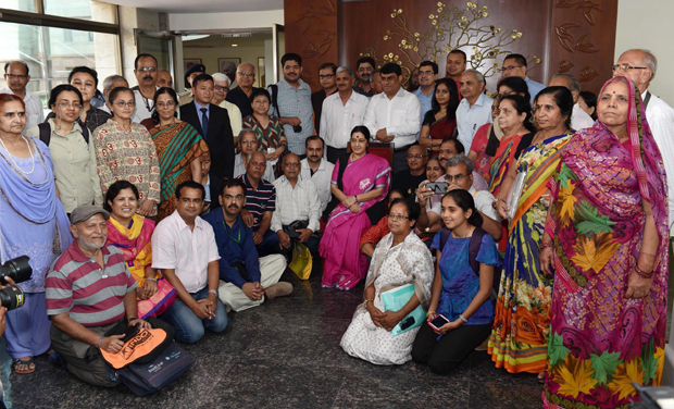 External Affairs Minister Sushma Swaraj poses with pilgrims for photographs during the flag off ceremony of the first batch of Kailash Mansarovar Yatris, who will travel by new route from Nathu La pass, in New Delhi (Photo: PTI) External Affairs Minister Sushma Swaraj poses with pilgrims for photographs during the flag off ceremony of the first batch of Kailash Mansarovar Yatris, who will travel by new route from Nathu La pass, in New Delhi (Photo: PTI)