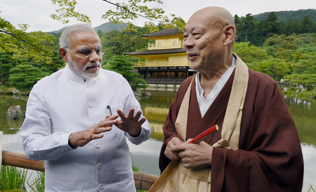 Prime Minister Narendra Modi along with head priest during his visit to the Kinkaku-ji Temple, the Zen Buddhist temple in Kyoto, Japan (Photo: PTI) Prime Minister Narendra Modi along with head priest during his visit to the Kinkaku-ji Temple, the Zen Buddhist temple in Kyoto, Japan (Photo: PTI)
