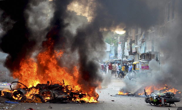 Several motorcyles burn after clashes between two different religious groups in Vadodara (Photo: PTI) Several motorcyles burn after clashes between two different religious groups in Vadodara (Photo: PTI)