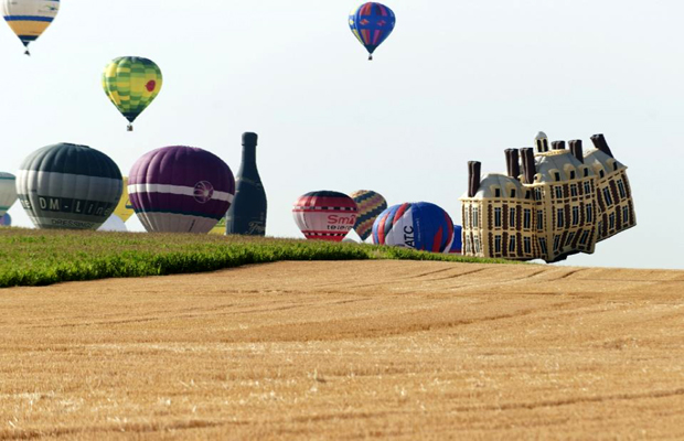 The balloons, including some spectacular designs such as a French chateau and rotund cartoon character Obelix, took off from Chambley-Bussieres air base to beat the previous record for simultaneous hot air balloon flights. (Photo: AFP) The balloons, including some spectacular designs such as a French chateau and rotund cartoon character Obelix, took off from Chambley-Bussieres air base to beat the previous record for simultaneous hot air balloon flights. (Photo: AFP)