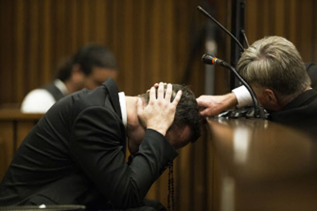 Paralympic athlete Oscar Pistorius covers his ears with his hands while a witness gives testimony and recounts the night of the crime when he killed his girlfriend Reeva Steenkamp. Photo- AFP
Paralympic athlete Oscar Pistorius covers his ears with his hands while a witness gives testimony and recounts the night of the crime when he killed his girlfriend Reeva Steenkamp. Photo- AFP