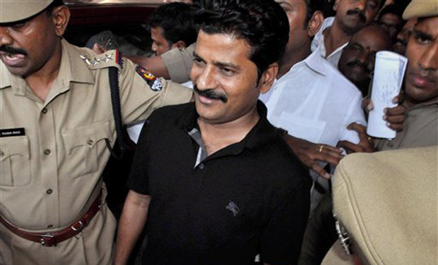 TDP lawmaker Revanth Reddy comes out after appearing before The Anti-Corruption Bureau in Hyderabad on Tuesday. (Photo: PTI) TDP lawmaker Revanth Reddy comes out after appearing before The Anti-Corruption Bureau in Hyderabad on Tuesday. (Photo: PTI)