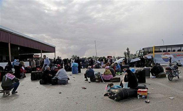 Palestinians wait near their luggage to cross the border to the Egyptian side at Rafah crossing in the southern Gaza Strip. In the Gaza Strip, a Palestinian border official said Egypt opened its border crossing with Gaza for the first time in two Palestinians wait near their luggage to cross the border to the Egyptian side at Rafah crossing in the southern Gaza Strip. In the Gaza Strip, a Palestinian border official said Egypt opened its border crossing with Gaza for the first time in two