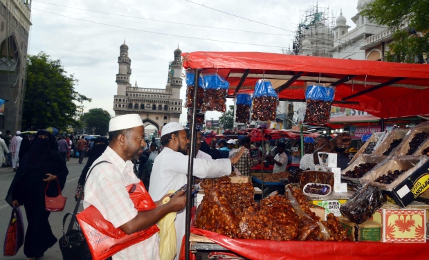 People purchasing fruits and dates on the eve of Ramzan in old city of Hyderabad (Photo: PTI) People purchasing fruits and dates on the eve of Ramzan in old city of Hyderabad (Photo: PTI)