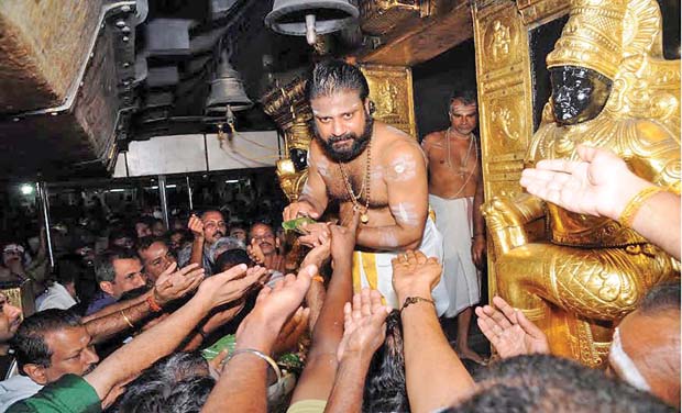 (Top) New Sabarimala Melshanthi E N Krishnadas Namboodiri all set to open the sanctum sanctorum at the Sabarimala temple; SI Sajish gives first aid treatment to a pilgrim who fell unconscious after the arduous trek to Sabarimala at Sannidhanam on (Top) New Sabarimala Melshanthi E N Krishnadas Namboodiri all set to open the sanctum sanctorum at the Sabarimala temple; SI Sajish gives first aid treatment to a pilgrim who fell unconscious after the arduous trek to Sabarimala at Sannidhanam on
