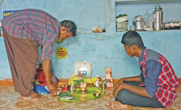 G. Tiraviyam along with his son Dhanush mourning death of his wife Shenbaga Devi (Photo: DC) G. Tiraviyam along with his son Dhanush mourning death of his wife Shenbaga Devi (Photo: DC)
