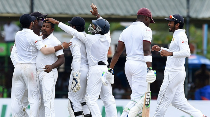 Sri Lanka's Sports Minister Dayasiri Jayasekera said a man linked to a bookmaker had offered wicketkeeper Kusal Perera and star bowler Rangana Herath around $70,000 to engineer a Sri Lankan batting collapse in Galle Test against West Indies. (Photo Sri Lanka's Sports Minister Dayasiri Jayasekera said a man linked to a bookmaker had offered wicketkeeper Kusal Perera and star bowler Rangana Herath around $70,000 to engineer a Sri Lankan batting collapse in Galle Test against West Indies. (Photo