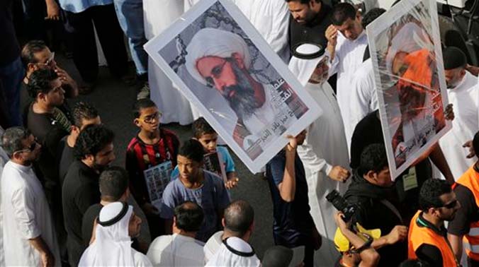 Saudis carry a poster demanding freedom for jailed Shiite cleric Sheikh Nimr al-Nimr, during a funeral procession, in Tarut, Saudi Arabia. (Photo: AP) Saudis carry a poster demanding freedom for jailed Shiite cleric Sheikh Nimr al-Nimr, during a funeral procession, in Tarut, Saudi Arabia. (Photo: AP)