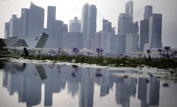 The Naidu government has roped in the Singapore government with a team of designers and architects for designing the capital at Tullur of Guntur district
A reflection of the financial skyline of Singapore (Photo: AP) The Naidu government has roped in the Singapore government with a team of designers and architects for designing the capital at Tullur of Guntur district
A reflection of the financial skyline of Singapore (Photo: AP)