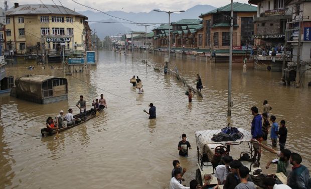 Flood-affected people commute in the city center of Srinagar (Photo: PTI) Flood-affected people commute in the city center of Srinagar (Photo: PTI)